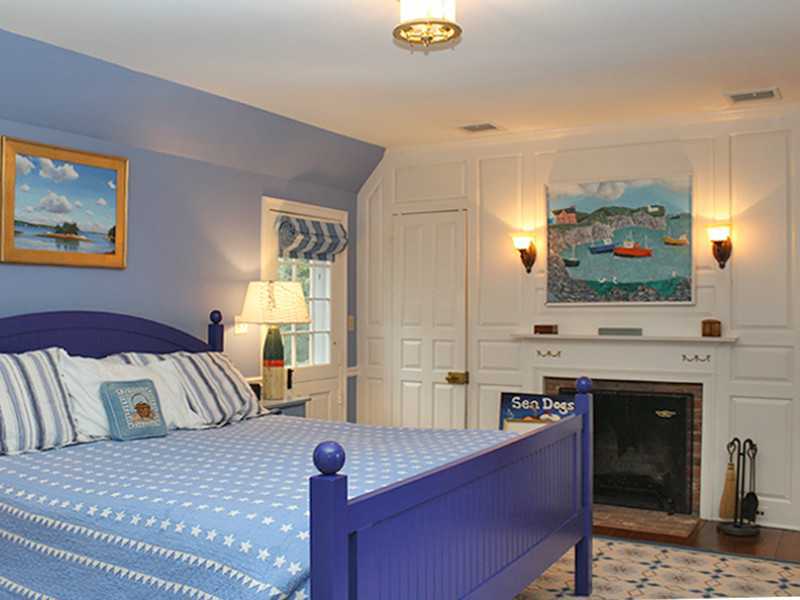 28 Leeward Lane Riverside, CT 06878 - Photo 12 of 23 a spacious bedroom with a bed and a flat screen tv