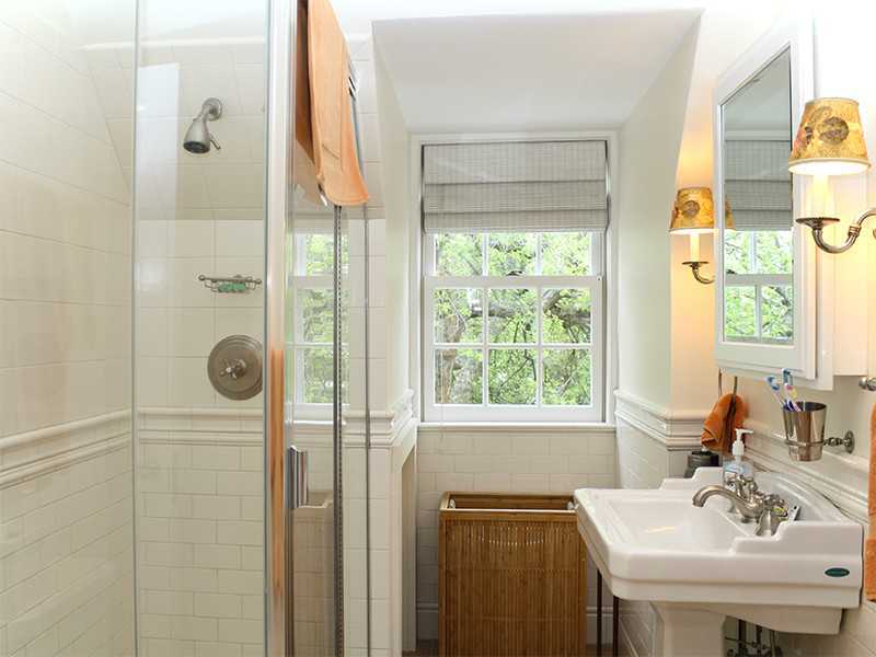 28 Leeward Lane Riverside, CT 06878 - Photo 16 of 23 a bathroom with a sink a mirror and a window