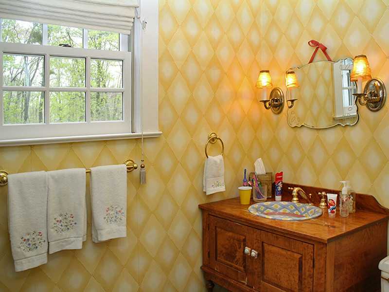 28 Leeward Lane Riverside, CT 06878 - Photo 17 of 23 a bathroom with a granite countertop sink a large mirror and a bathtub