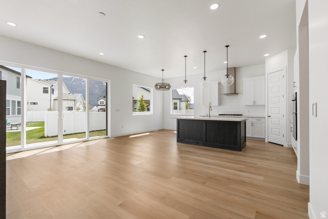 43 South Crimson Way, Unit 311 Mapleton, UT 84664 - Photo 4 of 28 Open-concept living space featuring light wood-finish flooring and recessed lighting