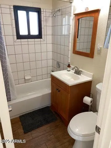 a bathroom with a sink a toilet and bathtub