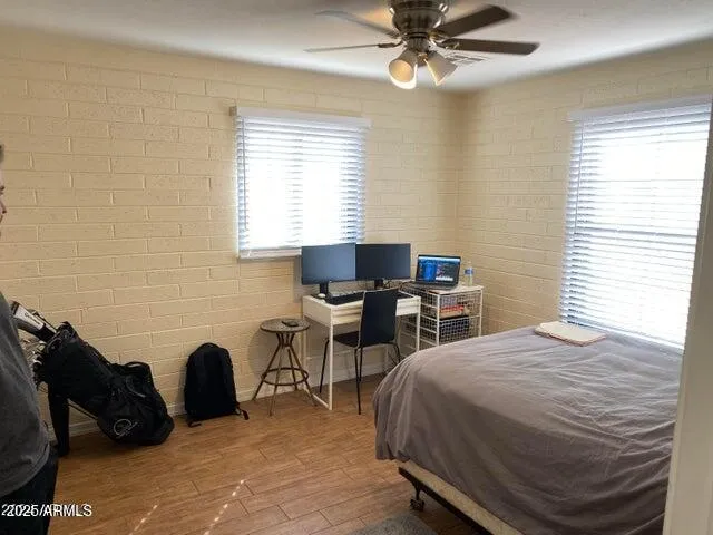 a bedroom with a bed and a table