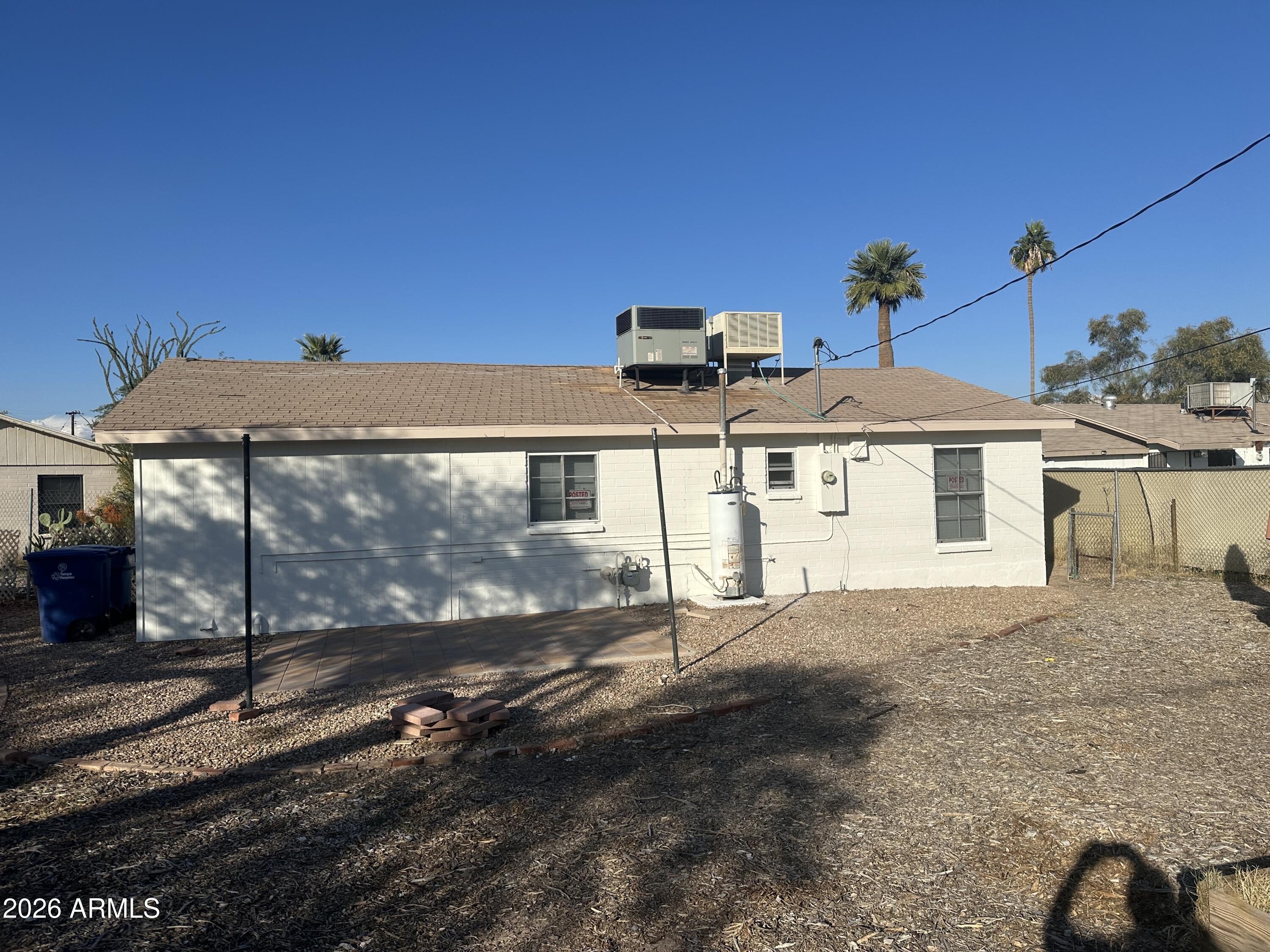 925 East Henry Street Tempe, AZ 85288 - Photo 19 of 21 a view of a house with backyard and a tree