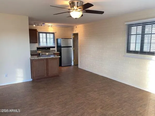a view of a kitchen with a stove cabinets