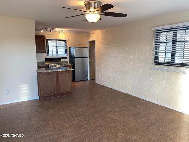 a view of a kitchen with a stove cabinets