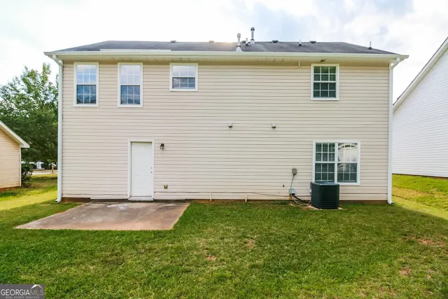 a view of a backyard with plants