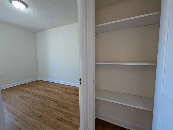 a view of an empty walk in closet