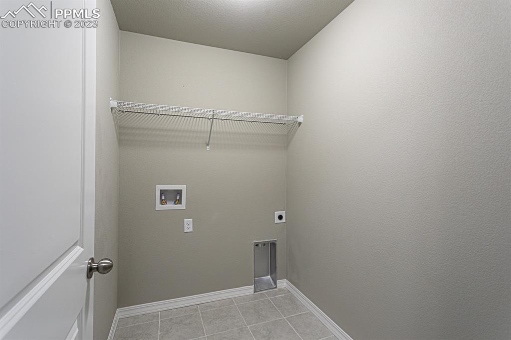 4336 Samaritan Loop Colorado Springs, CO 80916 - Photo 14 of 22 a view of a room with shelf
