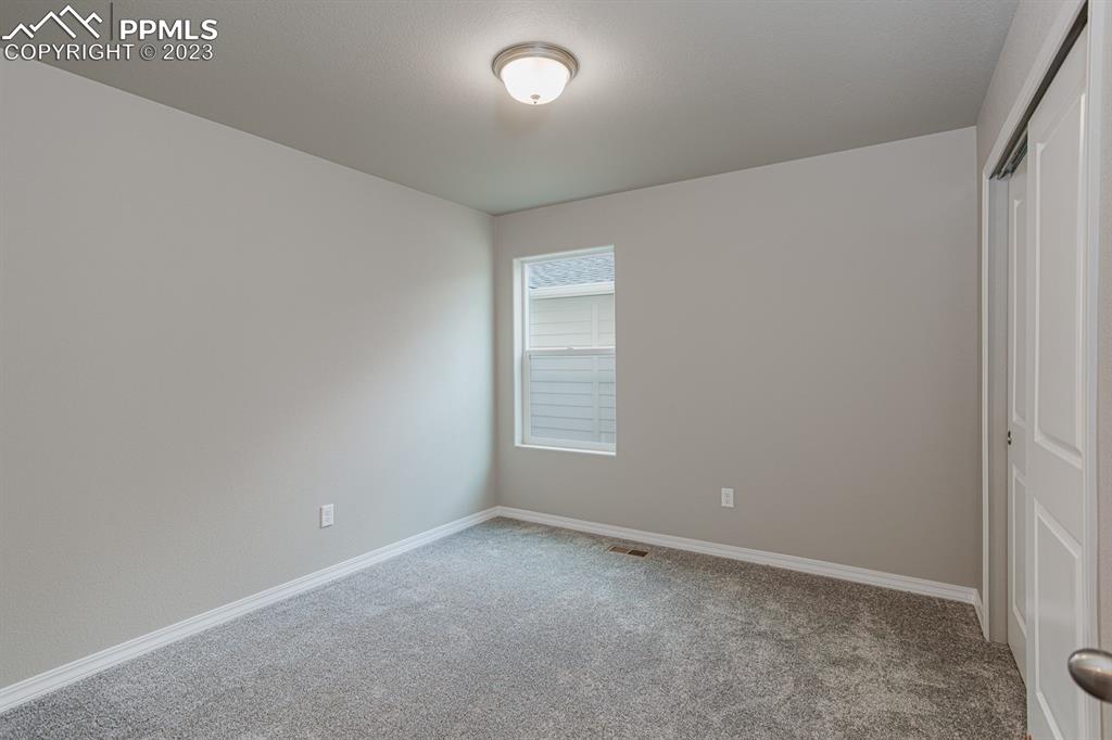 4336 Samaritan Loop Colorado Springs, CO 80916 - Photo 17 of 22 a view of an empty room and window