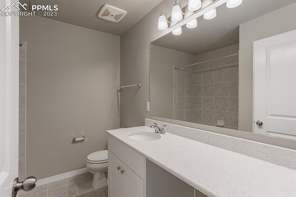 4336 Samaritan Loop Colorado Springs, CO 80916 - Photo 18 of 22 a bathroom with a sink a toilet and shower