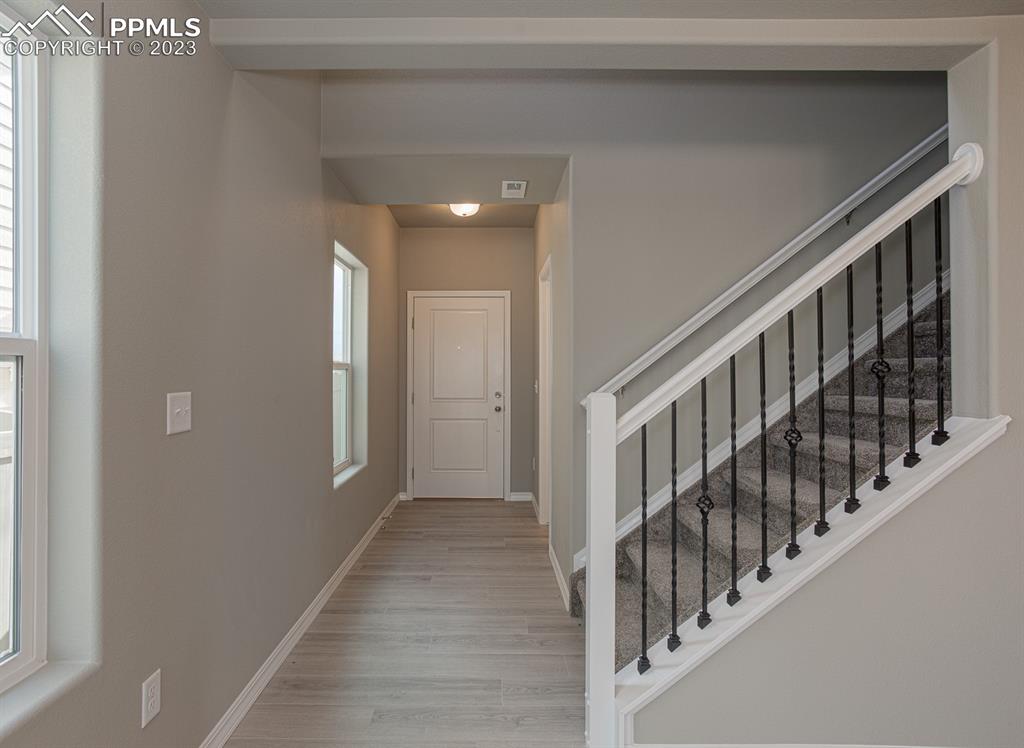 4336 Samaritan Loop Colorado Springs, CO 80916 - Photo 2 of 22 a view of an entryway with wooden floor