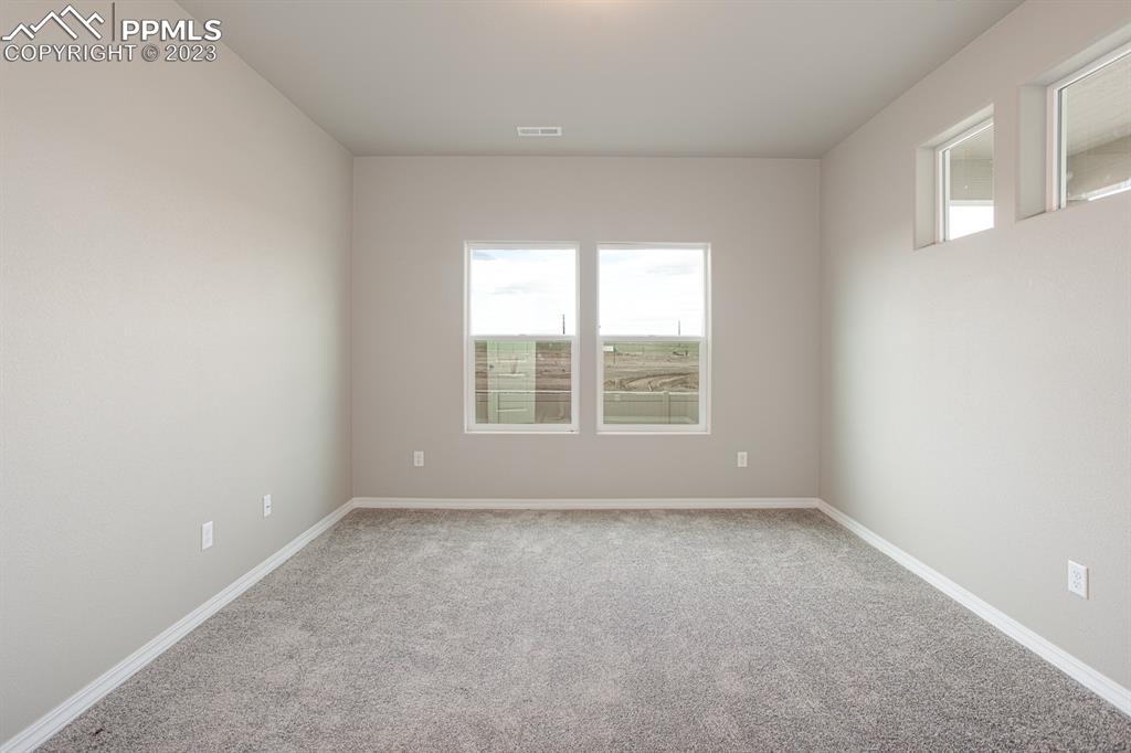 4336 Samaritan Loop Colorado Springs, CO 80916 - Photo 8 of 22 an empty room with a window