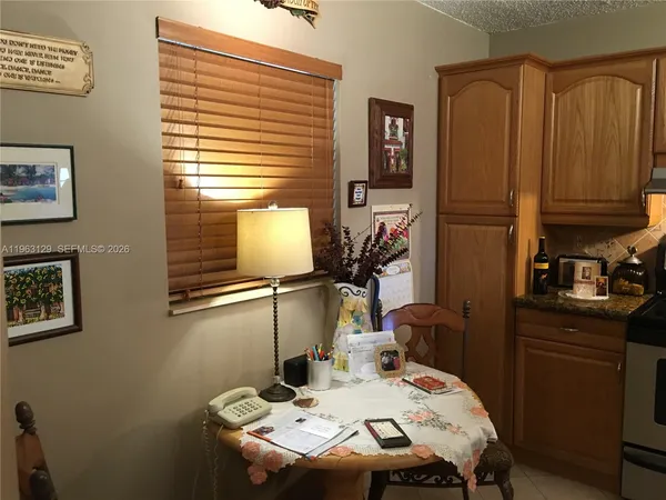 a dining room with furniture and window