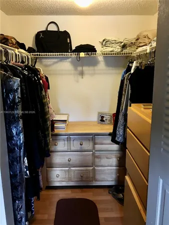 a white toilet sitting next to a shower