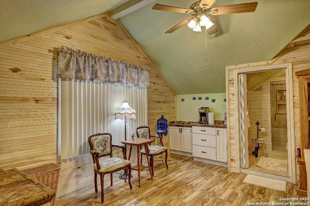 101 North 11th Street Junction, TX 76849 - Photo 13 of 26 a view of a workspace with furniture and chandelier fan