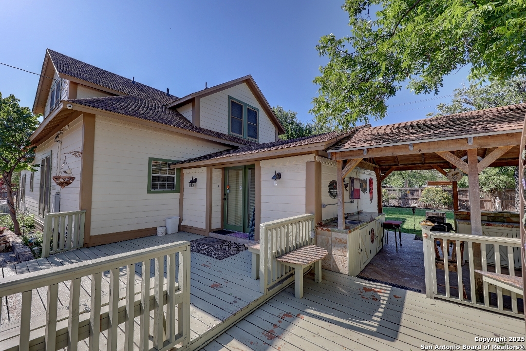 101 North 11th Street Junction, TX 76849 - Photo 21 of 26 a front view of house with deck and outdoor seating