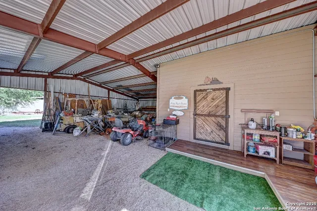 a view of a garage with a table and chairs