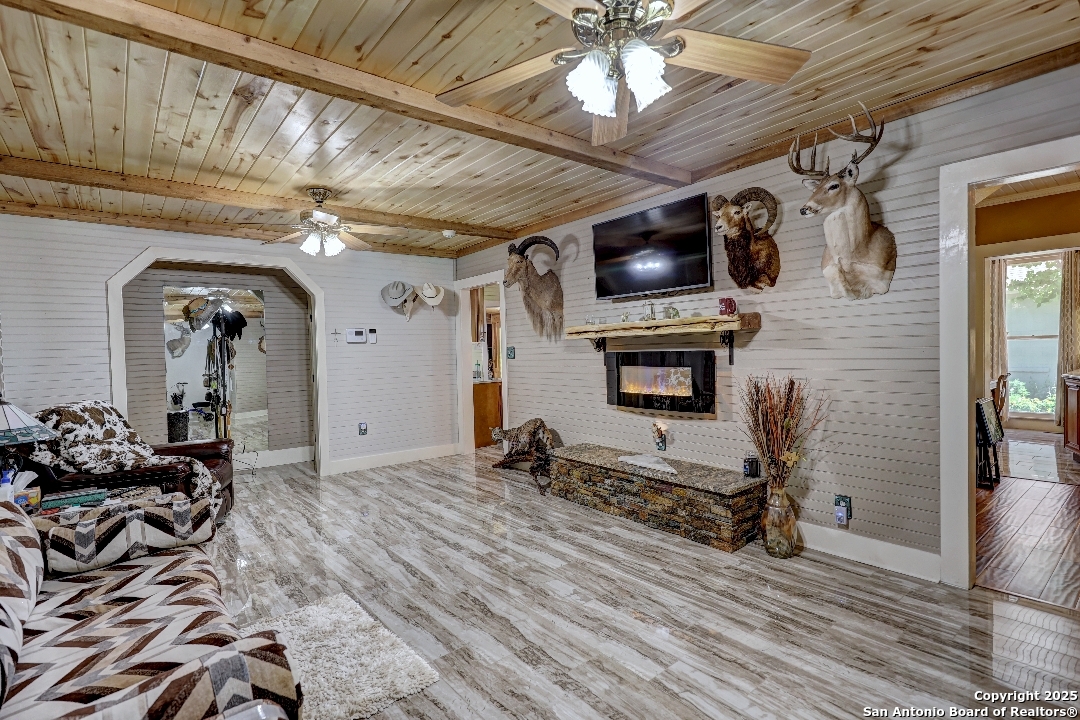 101 North 11th Street Junction, TX 76849 - Photo 10 of 26 a view of a livingroom with furniture and a ceiling fan