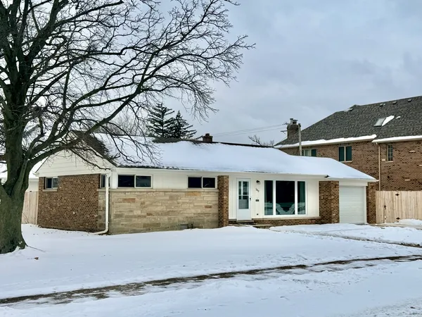 a front view of a house with yard