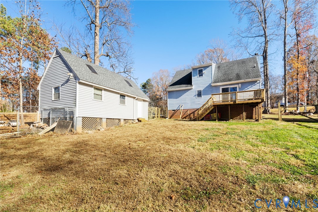 2015 Oneida Road Powhatan, VA 23139 - Photo 11 of 24 Back of house with roof with shingles, a deck, sta