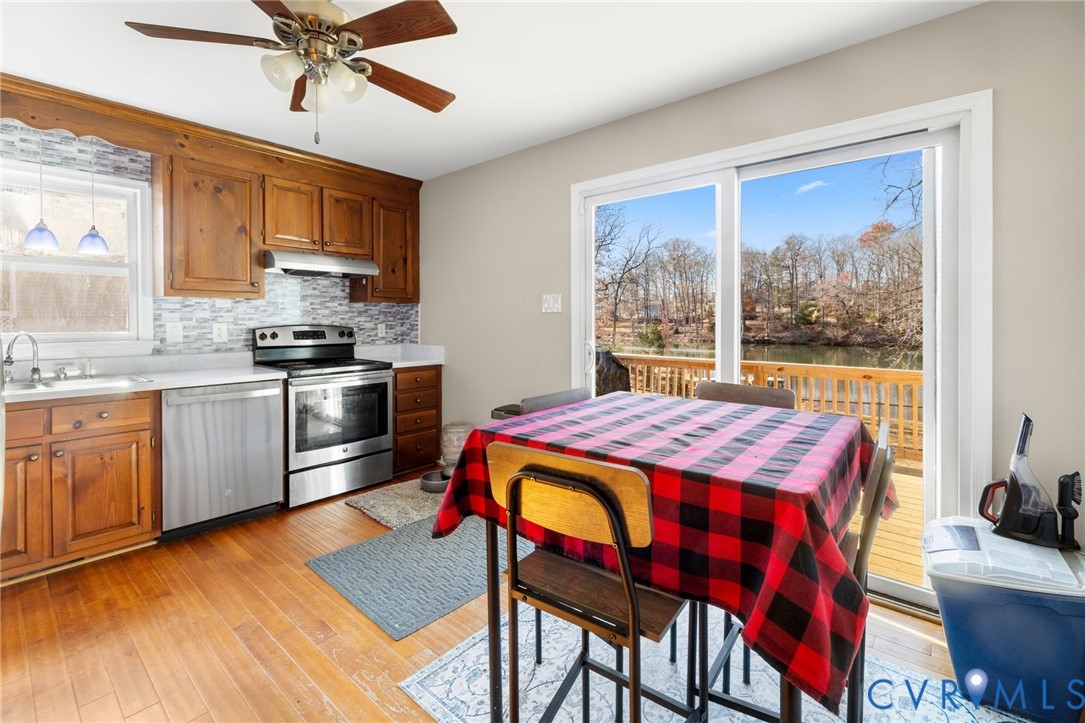 2015 Oneida Road Powhatan, VA 23139 - Photo 15 of 24 Kitchen featuring brown cabinets, appliances with