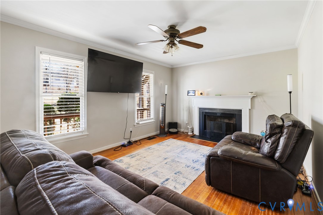 2015 Oneida Road Powhatan, VA 23139 - Photo 17 of 24 Living area featuring ornamental molding, a firepl