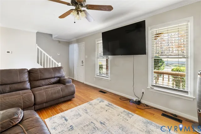 a living room with a flat screen tv and a window