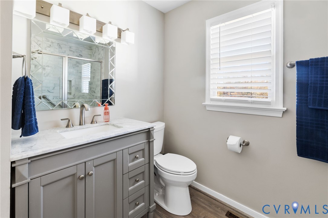 2015 Oneida Road Powhatan, VA 23139 - Photo 22 of 24 Bathroom featuring a marble finish shower, vanity,