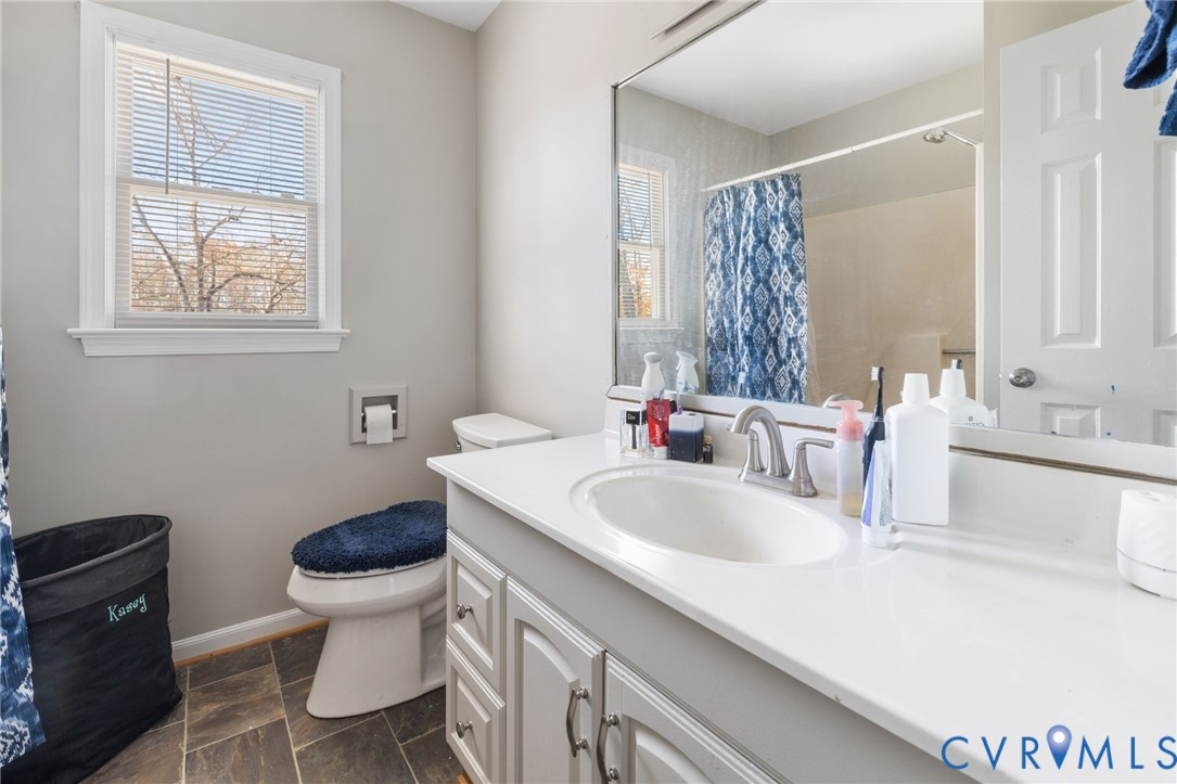 2015 Oneida Road Powhatan, VA 23139 - Photo 24 of 24 Bathroom with vanity, curtained shower, and dark s