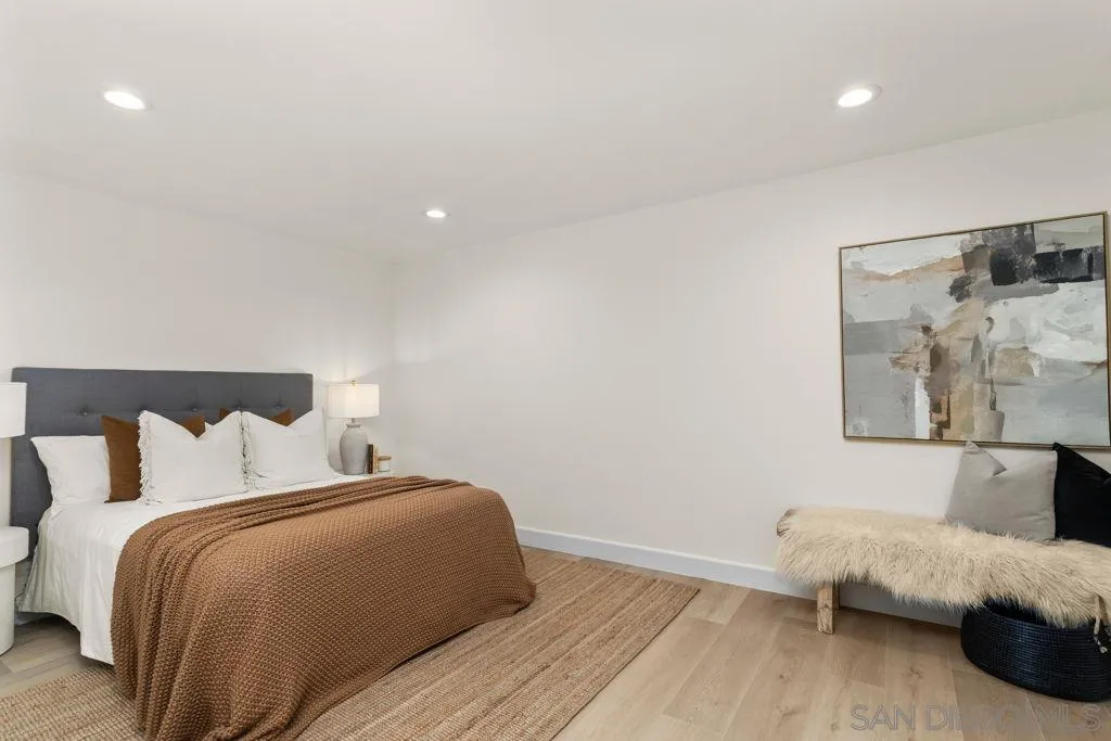 761 Brookstone Road, Unit 102 Chula Vista, CA 91913 - Photo 15 of 34 a bedroom with a bed and painting on the wall