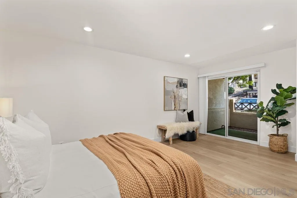 761 Brookstone Road, Unit 102 Chula Vista, CA 91913 - Photo 16 of 34 a bedroom with a bed and potted plant