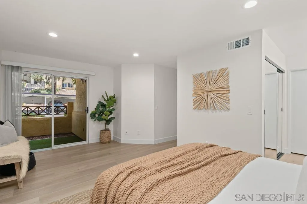 761 Brookstone Road, Unit 102 Chula Vista, CA 91913 - Photo 17 of 34 a bedroom with a bed and a large window