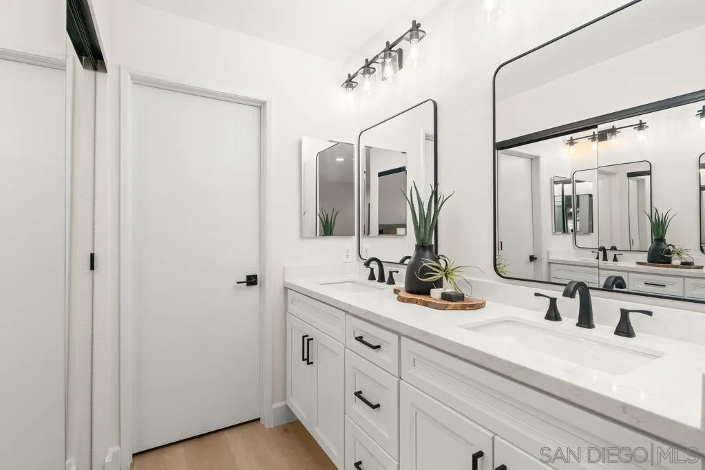 761 Brookstone Road, Unit 102 Chula Vista, CA 91913 - Photo 19 of 34 a bathroom with 2 sink and a mirror