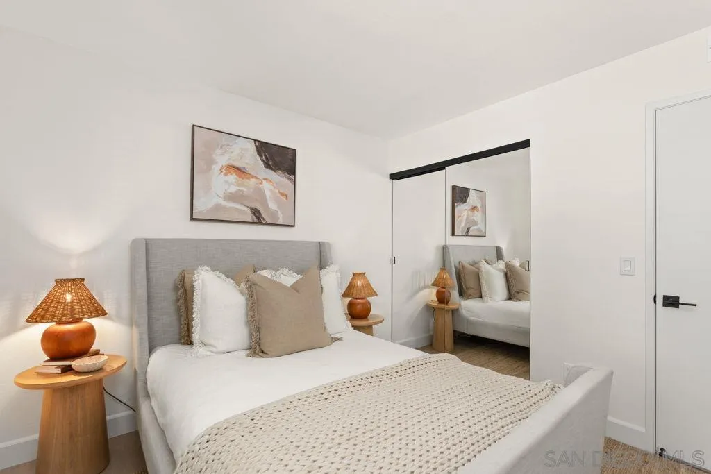 761 Brookstone Road, Unit 102 Chula Vista, CA 91913 - Photo 20 of 34 a bedroom with a bed and a couch
