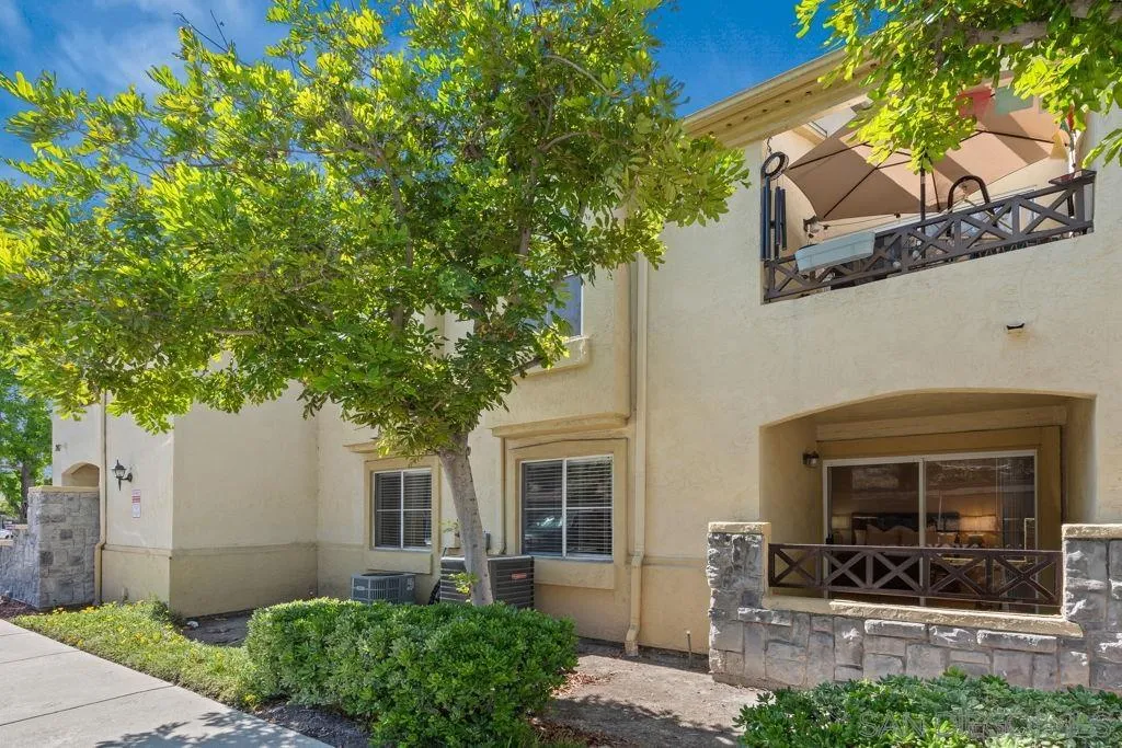 761 Brookstone Road, Unit 102 Chula Vista, CA 91913 - Photo 3 of 34 a front view of a house with a yard