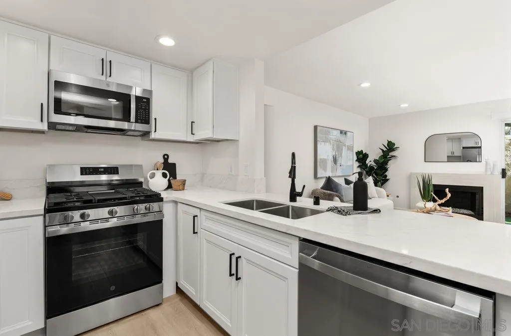 761 Brookstone Road, Unit 102 Chula Vista, CA 91913 - Photo 8 of 34 a kitchen with a sink stove and microwave