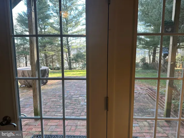 a view of a glass door with a roof deck