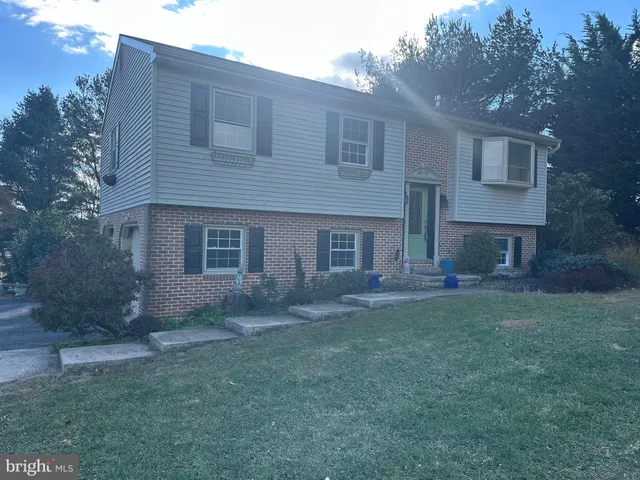 a brick house with a yard