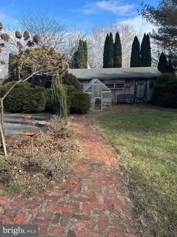 a view of a two chairs on the roof deck