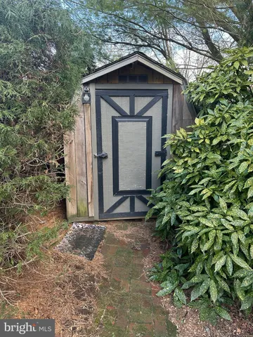 a view of a wooden door of the house