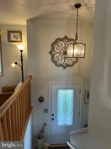 a view of a livingroom with furniture and chandelier