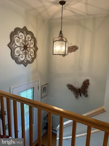a view of a hallway with a chandelier