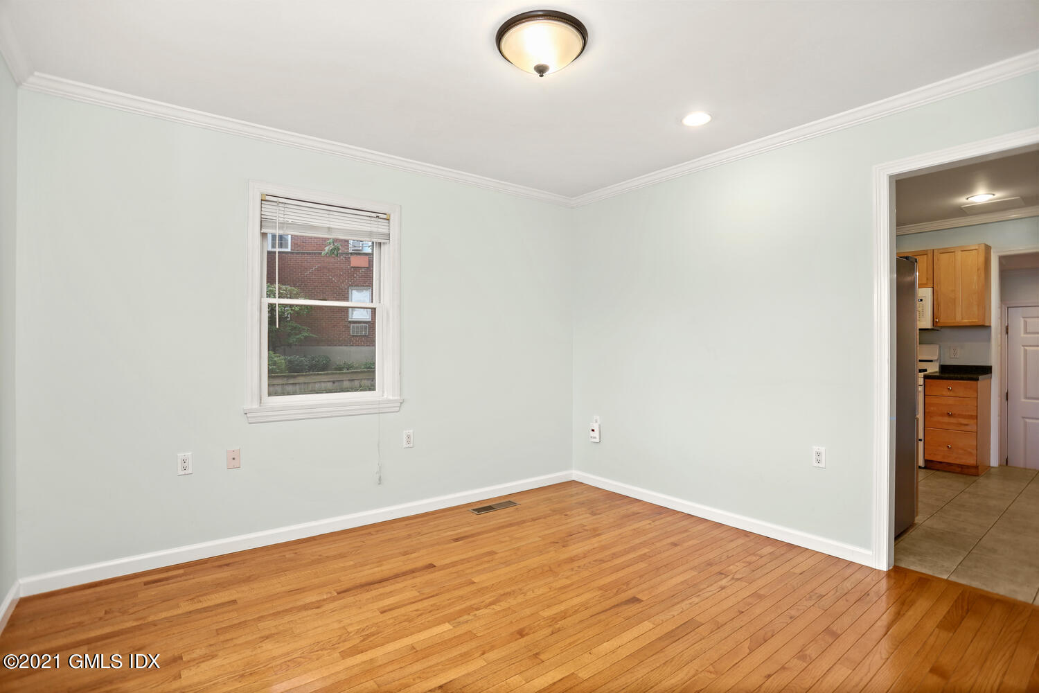 284 Glenbrook Road Stamford, CT 06906 - Photo 14 of 45 a view of empty room with wooden floor