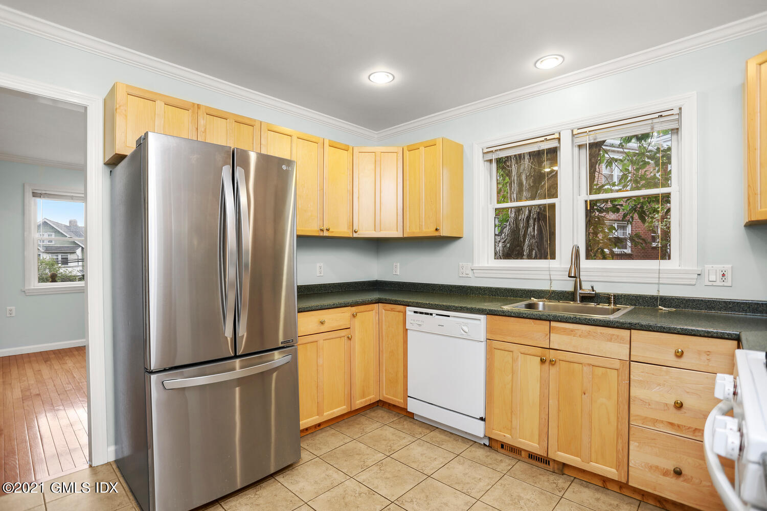 284 Glenbrook Road Stamford, CT 06906 - Photo 17 of 45 a kitchen with granite countertop stainless steel appliances a refrigerator a sink and cabinets