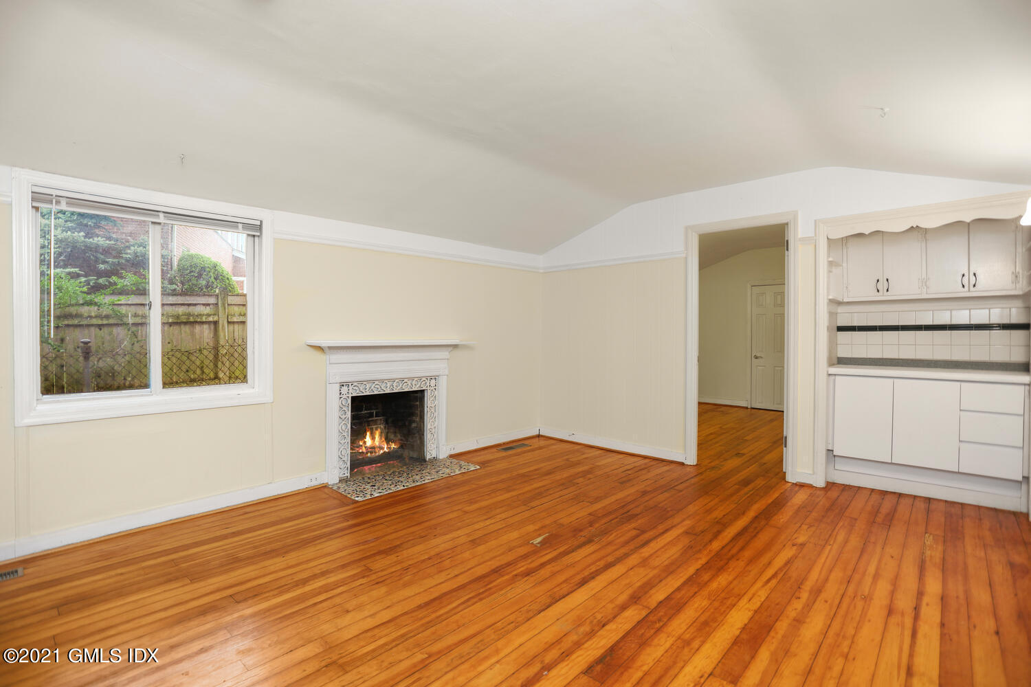 284 Glenbrook Road Stamford, CT 06906 - Photo 18 of 45 a view of empty room with wooden floor and fireplace