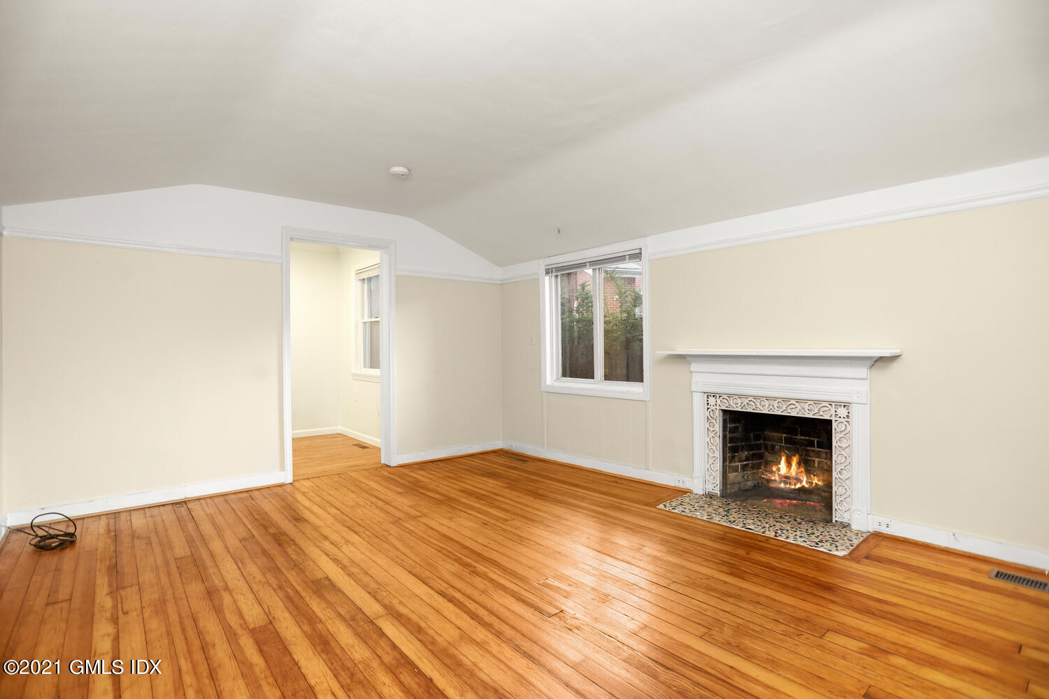 284 Glenbrook Road Stamford, CT 06906 - Photo 19 of 45 a bedroom with a bed and a fireplace