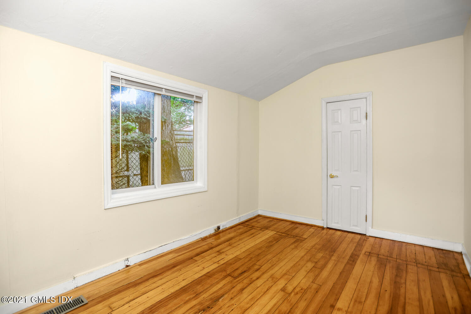 284 Glenbrook Road Stamford, CT 06906 - Photo 21 of 45 an empty room with wooden floor and windows