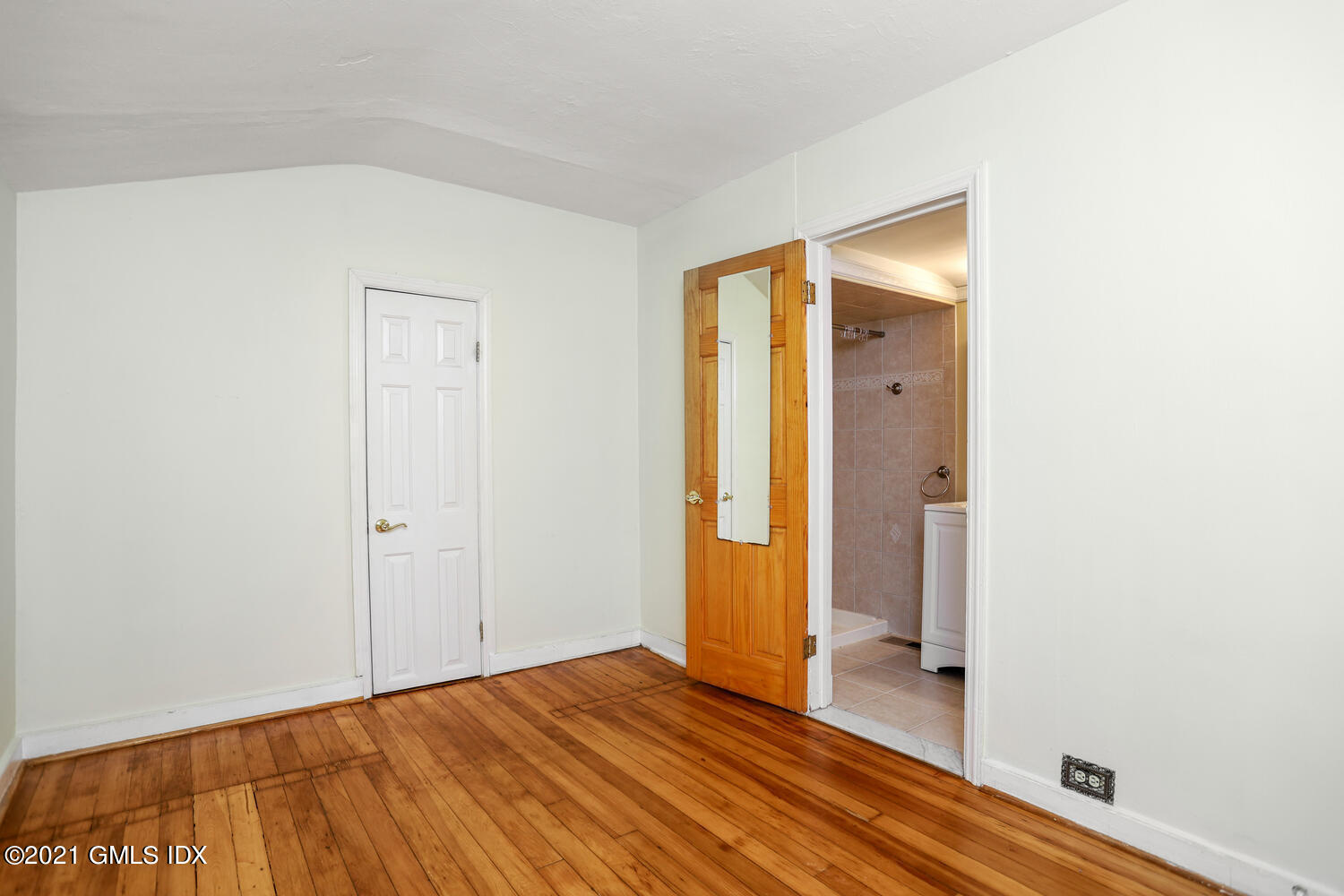 284 Glenbrook Road Stamford, CT 06906 - Photo 23 of 45 a view of a room with wooden floor and brick walls