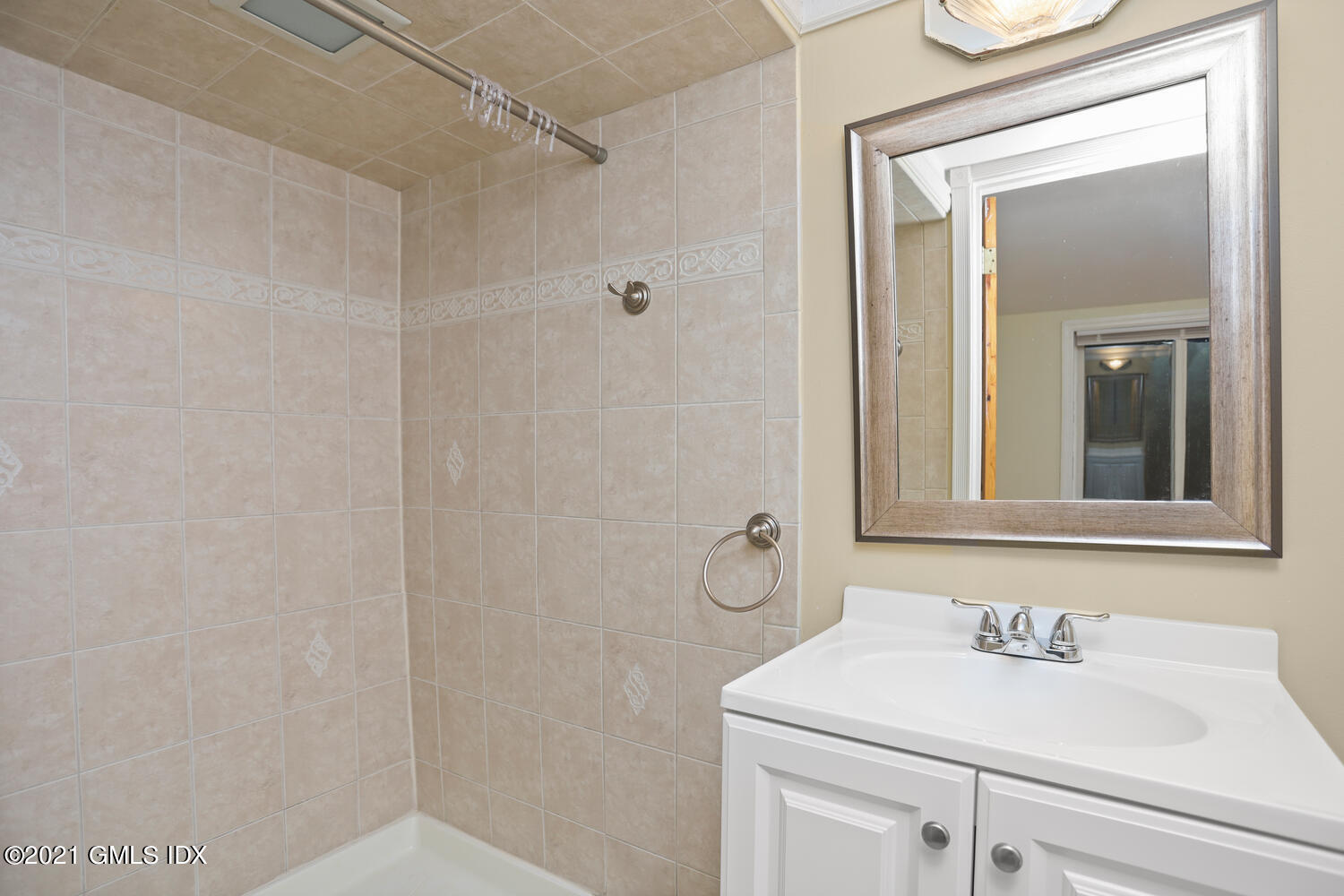 284 Glenbrook Road Stamford, CT 06906 - Photo 24 of 45 a bathroom with a sink and a mirror