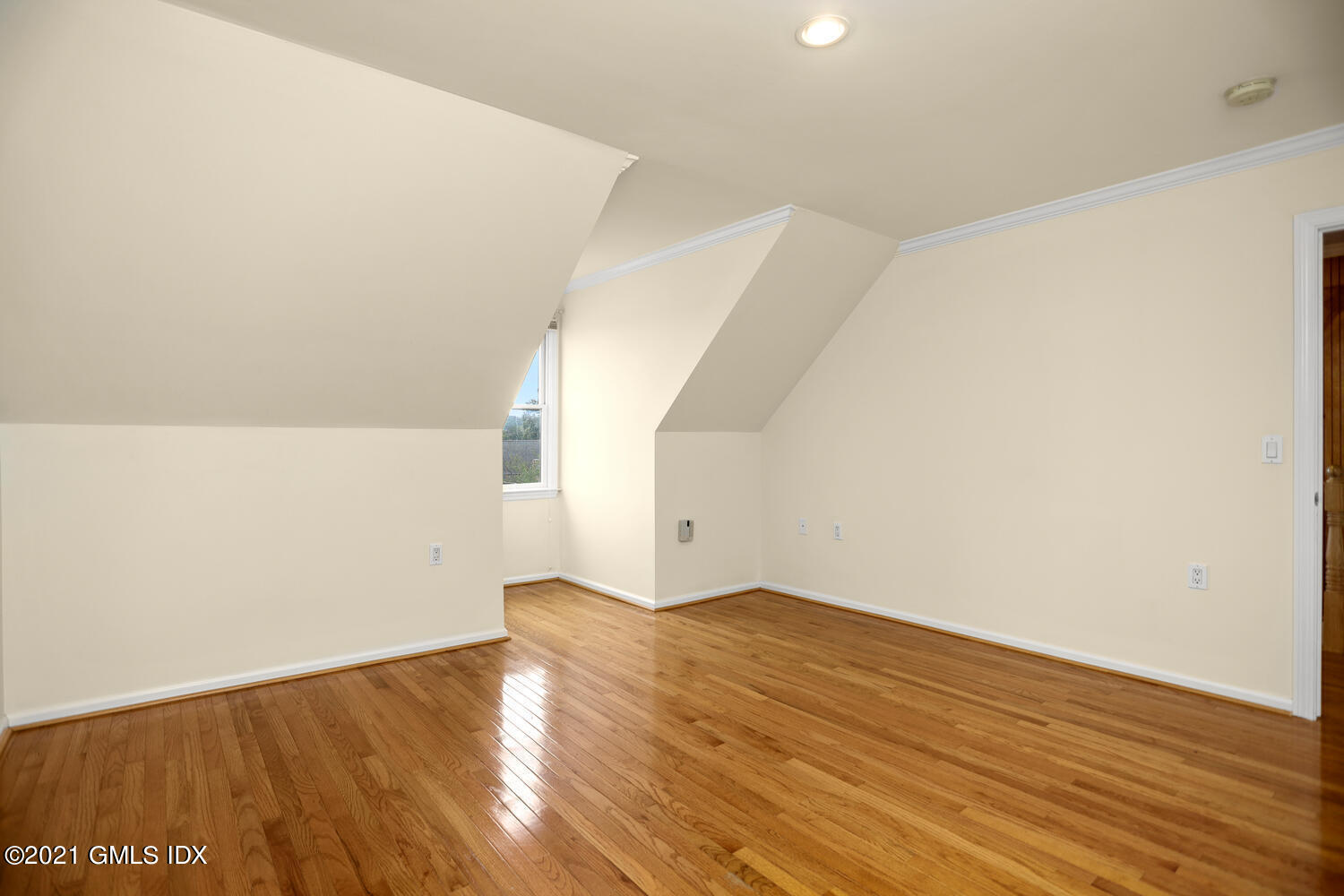 284 Glenbrook Road Stamford, CT 06906 - Photo 32 of 45 a view of an empty room with wooden floor